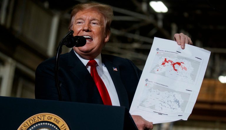 President Donald Trump holds up a chart documenting ISIS land loss in Iraq and Syria as delivers remarks at the Lima Army Tank Plant, Wednesday, March 20, 2019, in Lima, Ohio. In a campaign that spanned five years and two U.S. presidencies, the American military engineered the destruction of the Islamic State groupâs self-proclaimed empire in Iraq and Syria. Thatâs a military success, but not one thatâs certain to last. 