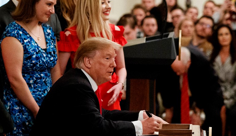 President Trump signs an executive order in D.C.