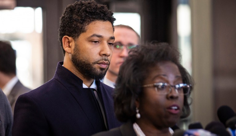 Actor Jussie Smollett, right, listens as his attorney, Patricia Brown Holmes, speaks to reporters at the Leighton Criminal Courthouse after prosecutors dropped all charges against him on Tuesday, March 26, 2019.