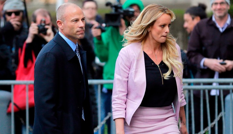 In this April 16, 2018 file photo, Stormy Daniels, right, and her attorney Michael Avenatti turn from the microphones after speaking as they leave federal court in New York. Avenatti, the trash-talking lawyer who became a household name by representing a porn star and hounding Donald Trump, is now in the legal fight of his life against federal charges that could send him to prison for the rest of his life.