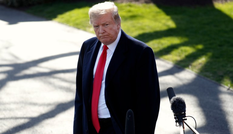 President Donald Trump listens to questions while speaking to the media after leaving the Oval Office of the White House, Thursday March 28, 2019, in Washington, en route to Michigan. Trump will speak at a rally in Michigan before spending the weekend at his Mar-a-Lago estate in Florida.