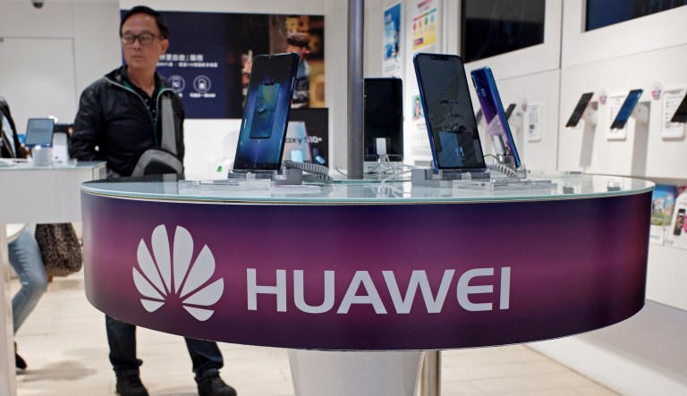 Huawei's mobile phones are displayed at a telecoms service shop in Hong Kong, Friday, March 29, 2019. Chinese tech giant Huawei's deputy chairman defended its commitment to security Friday after a stinging British government report added to Western pressure on the company by accusing it of failing to repair dangerous flaws in its telecom technology.