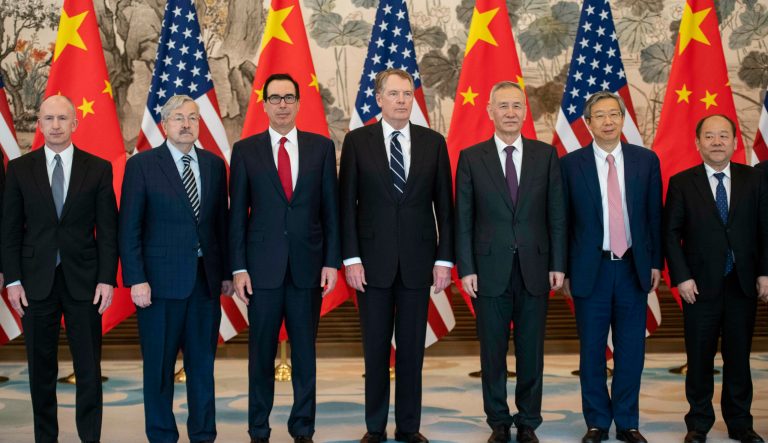 From left, U.S. Deputy Trade Representative Jeffrey Gerrish, U.S. Ambassador to China Terry Branstad, U.S. Treasury Secretary Steven Mnuchin, U.S. Trade Representative Robert Lighthizer, China's Vice Premier Liu He, Yi Gang, governor of the People's Bank of China (PBC) and National Development and Reform Commission Vice Chairman Ning Jizhe pose for a group photo at Diaoyutai State Guesthouse in Beijing Friday, March 29, 2019. 