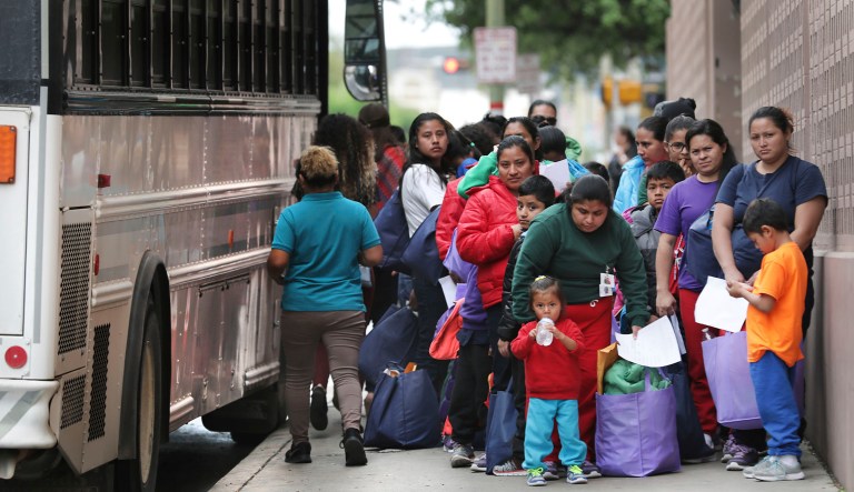 In this Friday, March 29, 2019 photo, migrants released from Texas detention centers arrive by the bus loads at the San Antonio bus station.