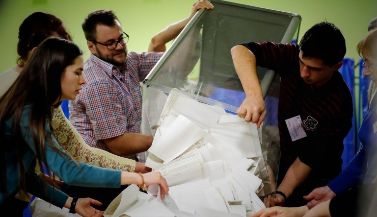 Election officials start counting ballots at a polling station during the presidential election in Kiev, Ukraine.