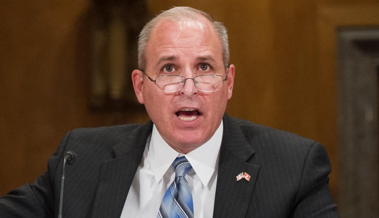 Former U.S. Border Patrol Chief Mark Morgan points to a photo of Drew Rosenberg during his testimony before the Senate Homeland Security and Governmental Affairs Committee's hearing on 'Unprecedented Migration at the U.S. Southern Border: By the Numbers', on Capitol Hill in Washington, Thursday, April 4, 2019.