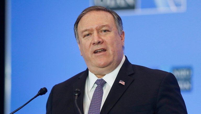 Secretary of State Mike Pompeo gestures while speaking during a news conference.