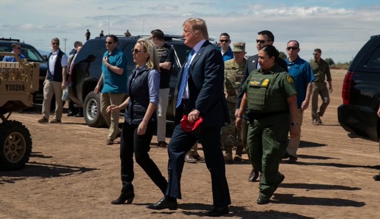 President Donald Trump walks with then-Homeland Security Secretary Kirstjen Nielsen as they visit a newly constructed part of a border wall with Mexico in  Calexico, Calif., Friday April 5, 2019. 