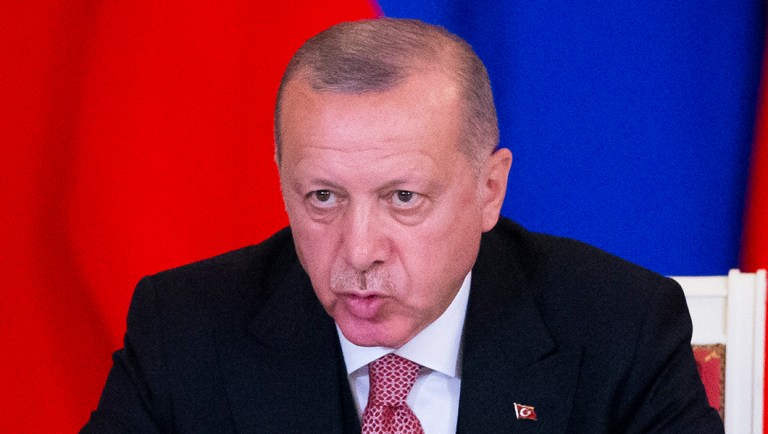 Turkish President Recep Tayyip Erdogan gestures while speaking.