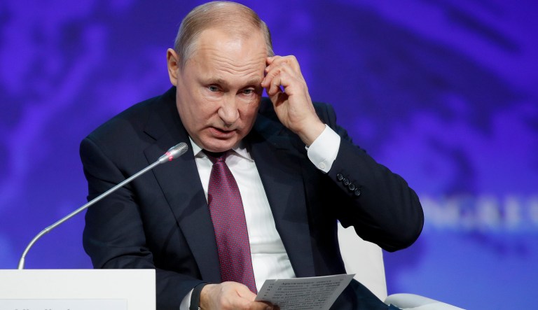 Russian President Vladimir Putin gestures while speaking at a plenary session of the International Arctic Forum in St. Petersburg, Russia, Tuesday, April 9, 2019.
