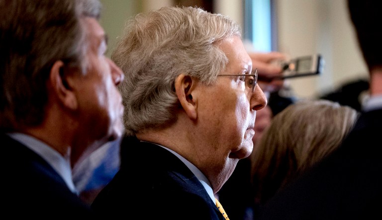 Senate Majority Leader Mitch McConnell of Ky., center, accompanied by Sen. Roy Blunt, R-Mo., left, appears during a news conference in D.C.