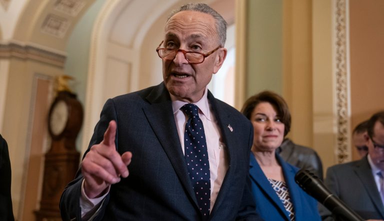 Senate Minority Leader Chuck Schumer, D-N.Y., joined at right by Sen. Amy Klobuchar, D-Minn., speaks to reporters at the Capitol in Washington, Tuesday, April 9, 2019. 