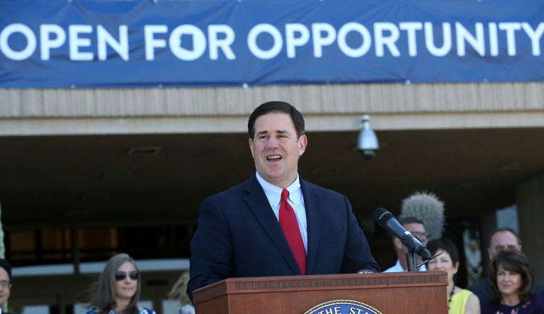 Republican Arizona Gov. Doug Ducey speaks prior to signing into law HB 2569 making Arizona the first state in the nation to provide universal recognition for occupational licenses at the Arizona Capitol, Wednesday, April 10, 2019, in Phoenix. 