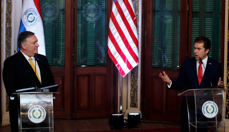 U.S. Secretary of State Mike Pompeo, left, listens to Paraguay's Vice President Luis Castiglioni, during a conference at "Palacio de Lopez", in Asuncion, Paraguay, Saturday, April 13, 2019. Pompeo is in the second of four countries' tour that includes Chile, Peru and Colombia to address, mainly, the crisis in Venezuela.