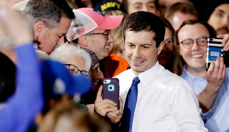 South Bend Mayor Pete Buttigieg poses for photos after he announces that he will seek the Democratic presidential nomination during a rally in South Bend, Ind. 