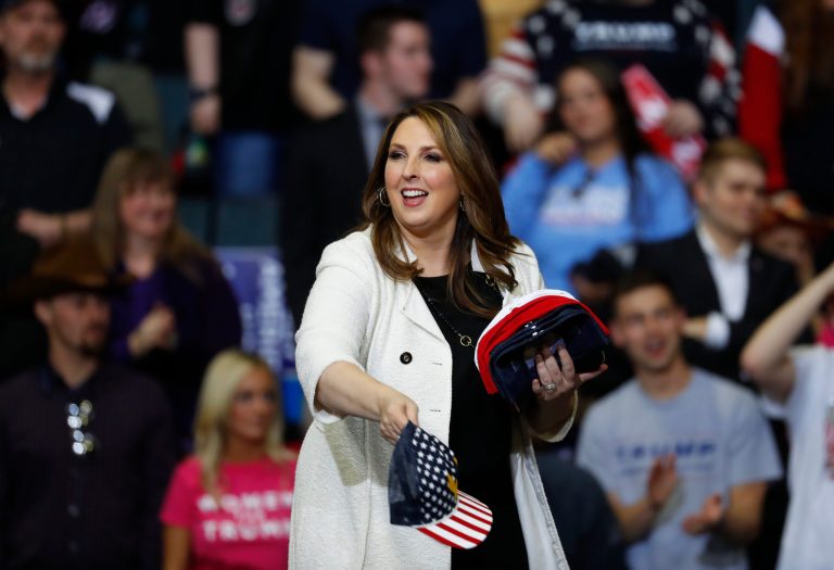Republican National Committee Chairwoman Ronna McDaniel throws hats to the audience at a rally for President Donald Trump in Grand Rapids, Mich., Thursday, March 28, 2019.