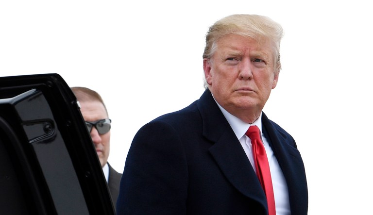 President Trump gets out of a car.