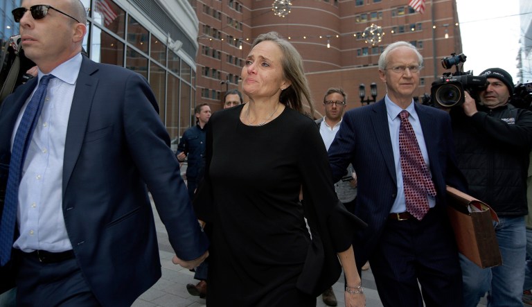 District Court Judge Shelley M. Richmond Joseph, center, departs federal court, Thursday, April 25, 2019, in Boston after facing obstruction of justice charges for allegedly helping a man in the country illegally evade immigration officials as he left her Newton, Mass., courthouse after a hearing in 2018.