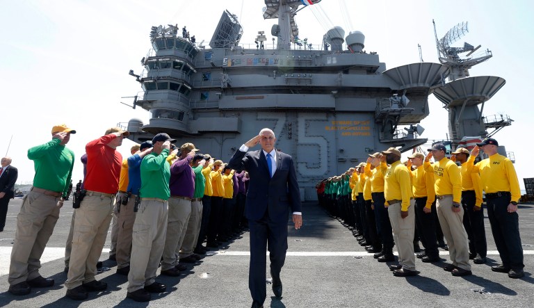 Vice President Mike Pence salutes flight deck crew during a tour aboard the nuclear aircraft carrier USS Harry S. Truman at the Naval Station Norfolk in Norfolk, Va., Tuesday, April 30, 2019.