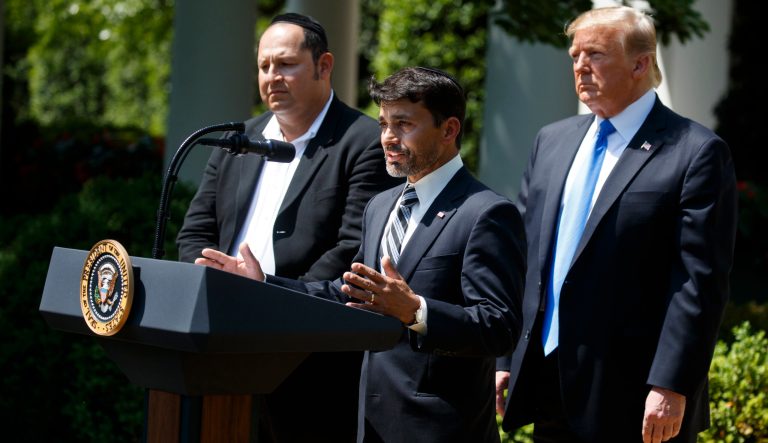 Jonathan Morales, left, and President Donald Trump, look on as Oscar Stewart speaks during a National Day of Prayer event in the Rose Garden of the White House, Thursday, May 2, 2019, in Washington. Morales and Stewart helped stop the gunman in the Poway, Calif., synagogue shooting. 