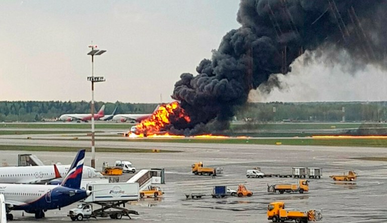 In this image provided by Riccardo Dalla Francesca shows smoke rises from a fire on a plane at Moscow's Sheremetyevo airport on Sunday, May 5, 2019. 
