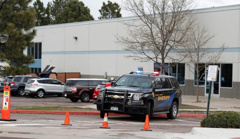 A Douglas County, Colo., Sheriff's Department vehicle blocks the entrance to the west parking lot of the STEM School Highlands Ranch after a shooting Tuesday, May 7, 2019, in Highlands Ranch, Colo. 