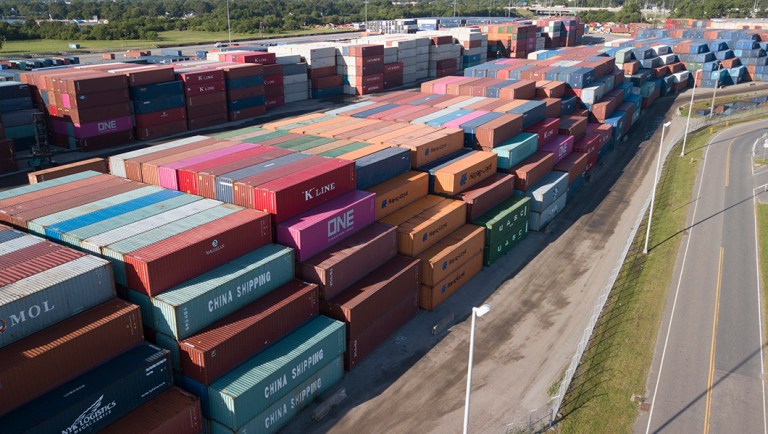 China Shipping Company and other containers are stacked at the Virginia International's terminal.