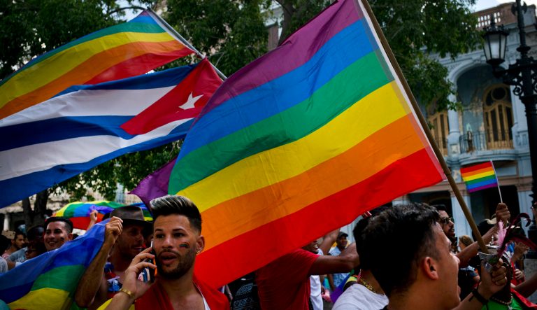 Gay rights activists take part in an unauthorized march in Havana, Cuba, Saturday, May 11, 2019.  The march was organized largely using Cuba's new mobile internet, with gay-rights activists and groups of friends calling for a march over Facebook and WhatsApp after the government-run gay rights organization cancelled a Saturday march. 