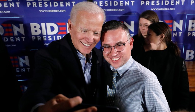 Former vice president and Democratic presidential candidate Joe Biden takes a selfie with a reporter during a campaign stop at the Community Oven in Hampton, N.H., Monday, May 13, 2019.