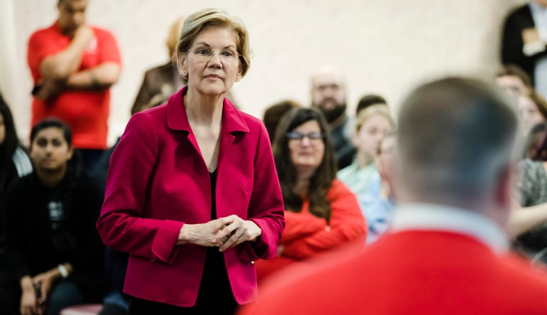 Democratic presidential candidate Sen. Elizabeth Warren, D-Mass., listens to a question at an event. 