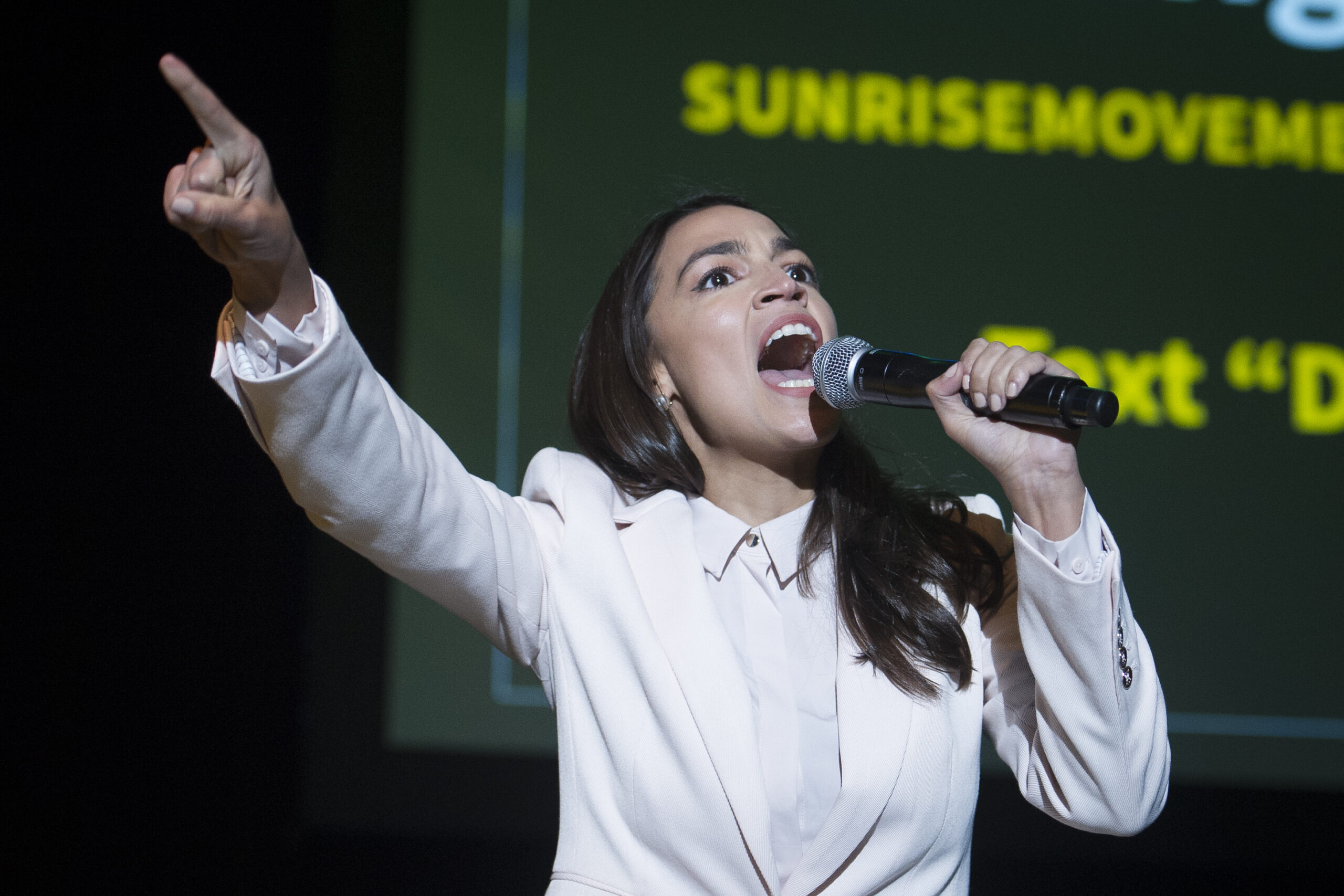 AOC and Bernie Sanders rally against ‘middle ground’ on Green New Deal