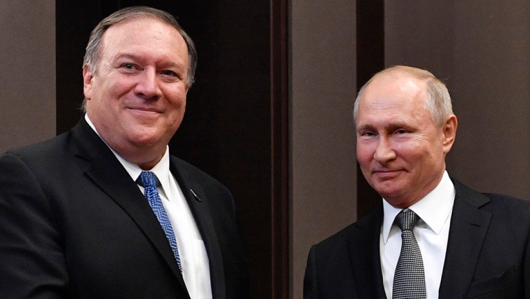 Russian President Vladimir Putin, right, and U.S. Secretary of State Mike Pompeo, pose for a photo.
