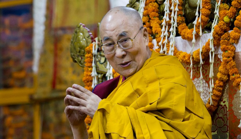 Tibetan spiritual leader the Dalai Lama sits on his ceremonial chair at Tsuglakhang temple in Dharmsala, India.