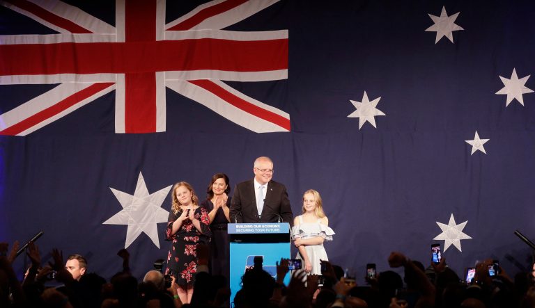 Australian Prime Minister Scott Morrison, second right, arrives on stage to speak to party supporters flanked by his wife, Jenny, and daughters Lily, and Abbey, left, after his opponent concedes defeat in the federal election in Sydney, Australia, Sunday, May 19, 2019. 