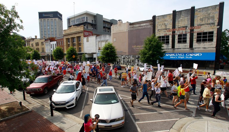 Protesters for women's rights march to the Alabama Capitol to protest a law passed last week making abortion a felony in nearly all cases with no exceptions for cases of rape or incest in Montgomery, Ala. 