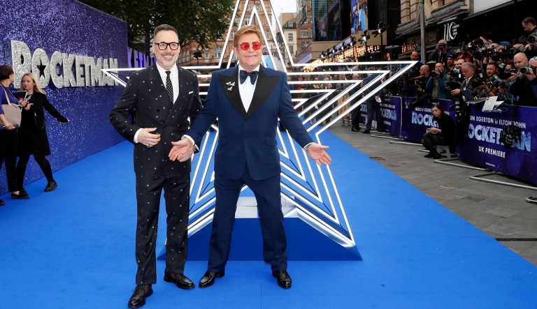 Musician Elton John and his husband producer David Furnish, left, arrive for the UK Film Premiere of Rocketman at the Odeon Luxe in London.