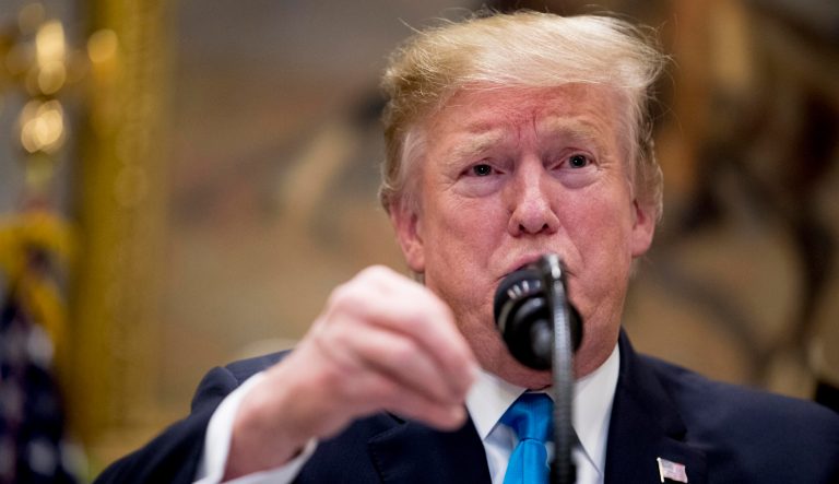 President Donald Trump gestures as he answers a question from a reporter during a meeting to support America's farmers and ranchers in the Roosevelt Room of the White House, Thursday, May 23, 2019, in Washington. 