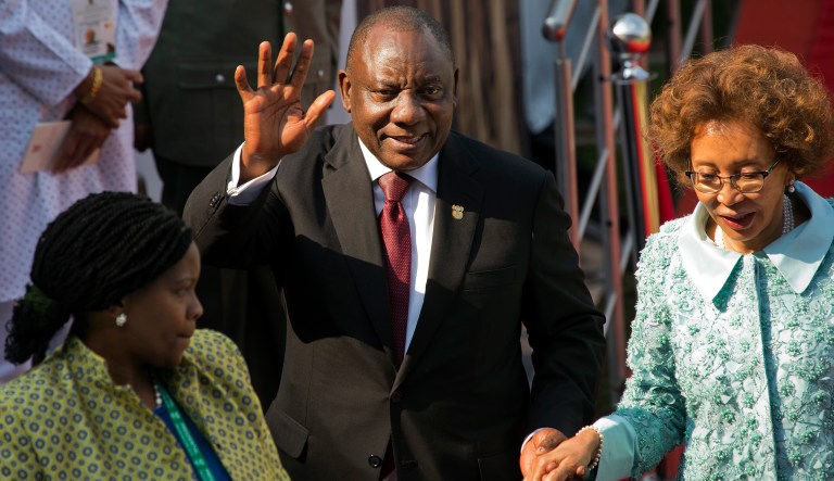 South African President Cyril Ramaphosa waves as he leaves after being sworn-in at Loftus Versfeld stadium in Pretoria, South Africa, Saturday May 25, 2019. Ramaphosa has vowed to crack down on the corruption that contributed to the ruling ANC' s weakest election showing in a quarter-century.