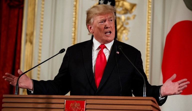 President Trump speaks during a news conference in Tokyo.