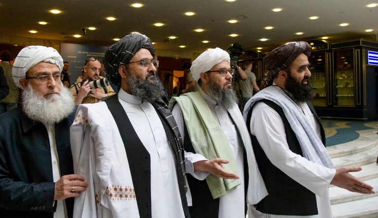Mullah Abdul Ghani Baradar, the Taliban group's top political leader, second from left, arrives with other members of the Taliban delegation for talks in Moscow, Russia.