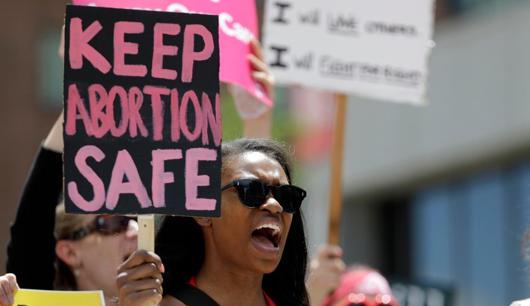 Abortion rights supporters take part in a protest, Thursday, May 30, 2019, in St. Louis.