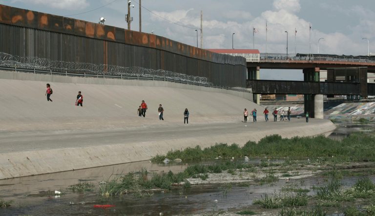 Migrant families cross the Rio Grande to get illegally across the border into the United States, to turn themselves in to authorities and ask for asylum, next to the Paso del Norte international bridge, near El Paso, Texas. 
