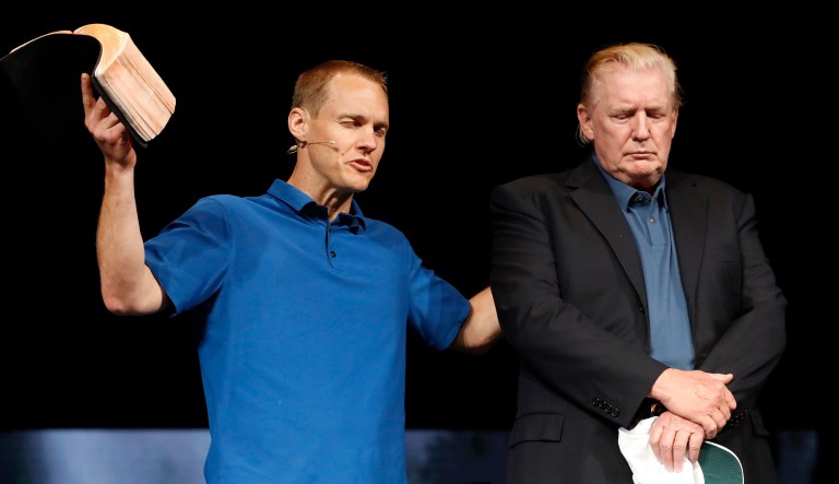 Pastor David Platt, left, prays for President Trump, at McLean Bible Church, in Vienna, Va.
