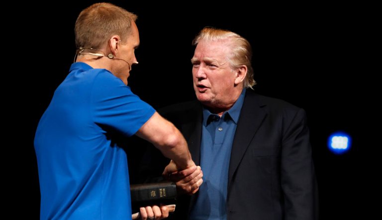 President Donald Trump shakes hands with Pastor David Platt, left, after receiving a prayer at McLean Bible Church, in Vienna, Va., Sunday June 2, 2019. 
