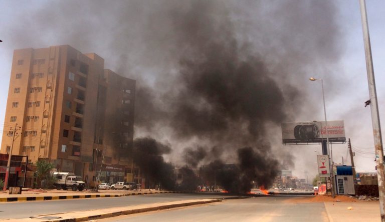 Burning tires set by protesters produce black smoke on road 60, near Khartoum's army headquarters, in Khartoum, Sudan, Monday, June 3, 2019. Sudanese protest leaders say at least 13 people have been killed in the military's assault on the sit-in outside the military headquarters in the capital, Khartoum. The protesters have announced they are suspending talks with the military regarding the creation of a transitional government. 
