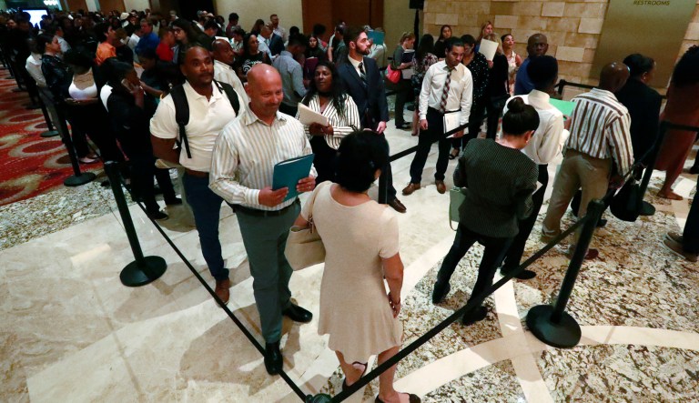 Job applicants line up during a job fair in Hollywood, Fla.