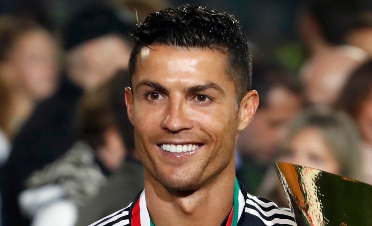 In this May 19, 2019 photo, Cristiano Ronaldo celebrates after winning the Serie A soccer title trophy, at the Allianz Stadium, in Turin, Italy. 