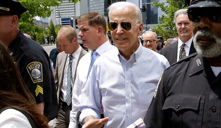 Former vice president and Democratic presidential candidate Joe Biden walks with Boston Mayor Marty Walsh, left, on Wednesday, June 5, 2019, in downtown Boston.