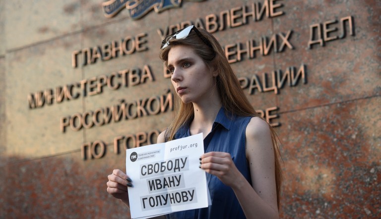 A protester holds a poster reading "Freedom for Ivan Golunov ", with one protester mounting a lone picket protest for detained journalist Ivan Golunov, at Russian Internal Ministry building in Moscow, Russia, Friday, June 7, 2019. Prominent Russian investigative journalist Golunov was detained Thursday and charged after four grams of the synthetic stimulant mephedrone were found in his backpack, Moscow police said Friday.