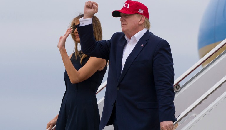 President Donald Trump pumps his fist as he and first lady Melania Trump step off Air Force One as they arrive, Friday, June 7, 2019, at Andrews Air Force Base, Md. Trump is returning from a trip to England, France and Ireland.